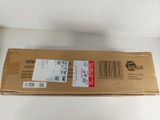 a cardboard box with a sticker on it sitting on a table