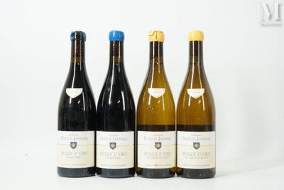 three bottles of wine are lined up on a white surface