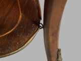 a close up view of a wooden table with a curved top