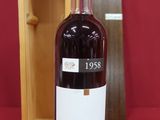 an image of a bottle of liquor sitting next to a wooden box