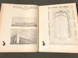 a book open on a table with pictures of buildings