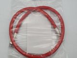 a close up of a red hose in a plastic bag