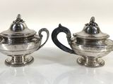 pair of silver plated teapots with handles and handles