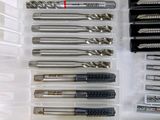 many different types of drill bits in a plastic box