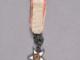 a close up of a medal with a star on it