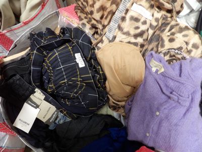 a suitcase full of clothes and clothes that are in it