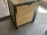 a desk with a drawer underneath it in a room