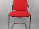 an image of a red office chair against a white backdrop