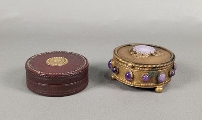 a small box with a purple stone inside of it