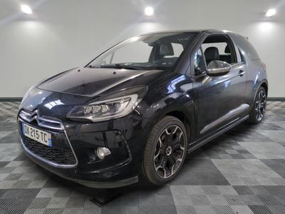 the black citrole is parked on a checkered floor