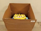 a cardboard box that has a box with a face on it