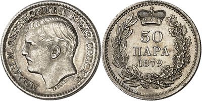 a silver coin with a crown on top of it