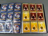 many pokemon cards in the case on the table
