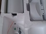 a white box with a speaker inside of it