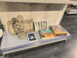 a shelf with pictures and pictures on it in a room