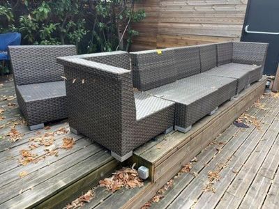 a couch that is sitting on a wooden deck
