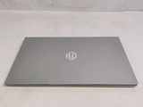 a laptop that is sitting on a white surface