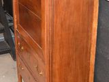 an old dresser with a marble top in a room