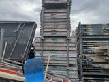 a pile of pallets and a snowboard on the ground