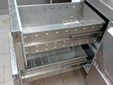 a stainless steel drawer in the middle of a kitchen