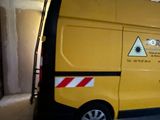 a yellow van that is parked in a garage