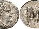 a silver coin with a head of a man on it