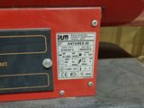 a red machine that is sitting on top of a table