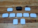 a wooden table with a bunch of white objects on it