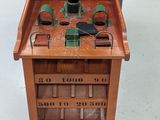 a small wooden table with a clock on top of it