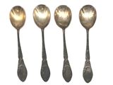 five spoons are lined up in a row on a white surface