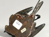 a metal bird with a tag on it ' s neck