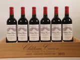 six bouteilles de vin rouge dans une caisse en bois sur une table