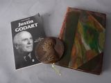 two books and a coin on a table