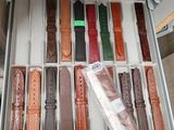 a drawer full of different colored watches in a store