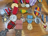 a wooden table with a lot of medals on it