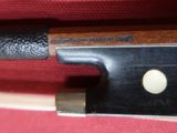 an image of a close up of a knife on a red cloth