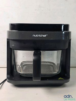 a black blender sitting on a counter with a white background