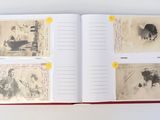 an open book with pictures of people and animals on it