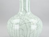 a white vase with a cracky design on it