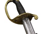 an image of a sword with a gold handle on a white background