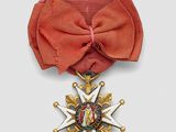 an image of a red ribbon with a gold star on it