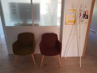 two chairs sitting next to each other in a room