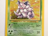 the pokemon card is hanging on the wall in the room