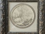 une vieille photo représentant un mouton dans un décor boisé