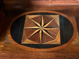 a wooden table with a star design on top of it