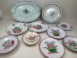 a lot of plates that are sitting on a table