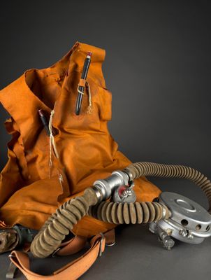 a bag with a gas mask on top of it