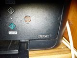 an image of a printer on a desk with a cord