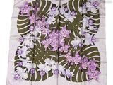a close up of a square scarf with purple flowers on it
