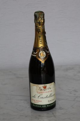 a bottle of champagne sitting on a table